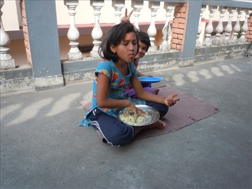 Eating dal bhat the traditional Nepalese way.