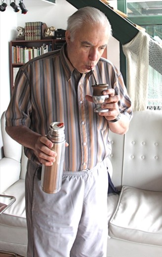 Raoul drinking mate, an Argentine addiction and an acquired taste