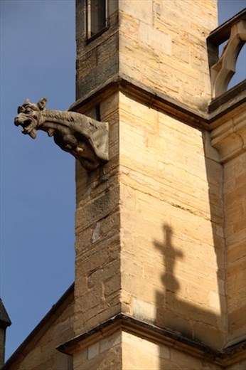 Gargoyle and cross, Notre Dame, Beaune