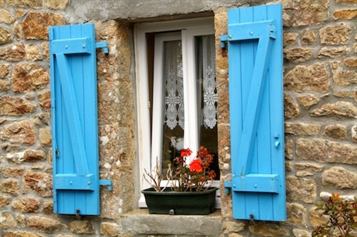 Blue shutters with geraniums, Brittany