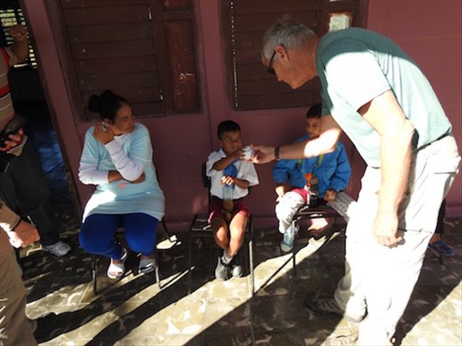 John handing out baseballs