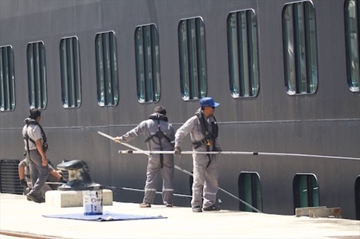 Oosterdam crew touches up inevitable scrapes and scratches from lock