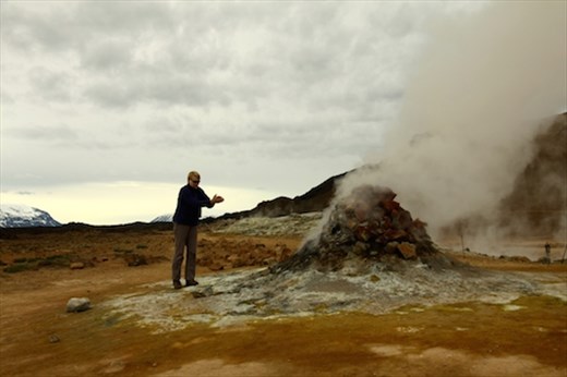 Connie warming her hands, Namafjall Geothermal Area