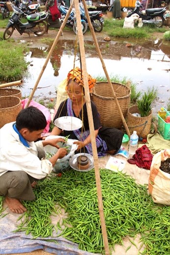 Weighing a hill of beans, Inthein market, Inle Lake