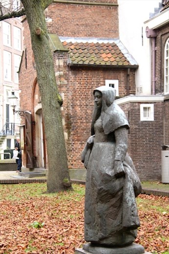 Statue and Reformed Church, Begijnhof, in Amsterdam