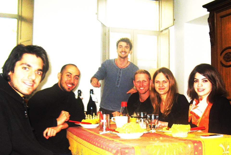 the group of people sharing the meal