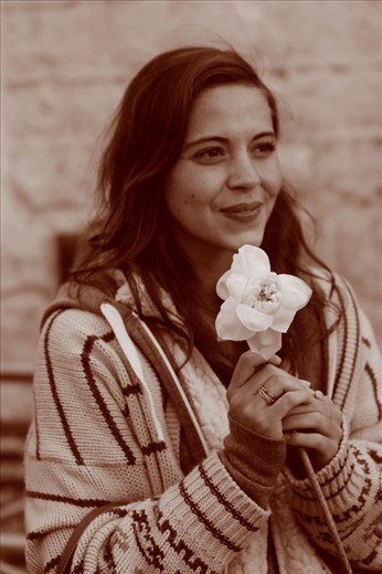 Tourist offering a Lotus flower at the shrine on top of Sri Pada / Adam's Peak Mountain.