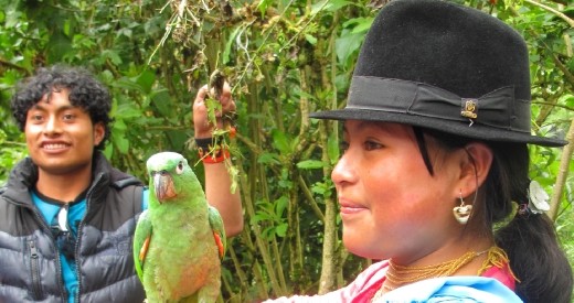 Beautiful woman holding parrot