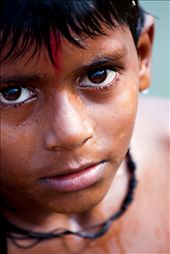 Testing the waters- A young boy swims in the Ganges river, he begins his life as a dedicated Hindu. He swam near my boat until i reached the shore to then welcome me to Varanasi.: by varanasi, Views[907]
