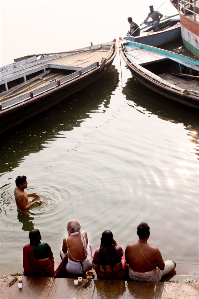 Family matters- A family visits the Ganges for a early morning bath. There are 3 generations that are captured in this photo. The young male begins his morning prayer ritual.
