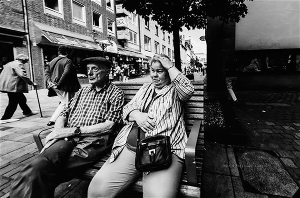 Pensioners sitting on the bench.