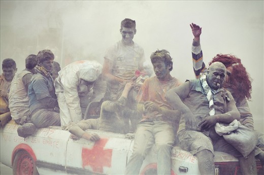 Coloring is added for effect while people paint their faces with charcoal