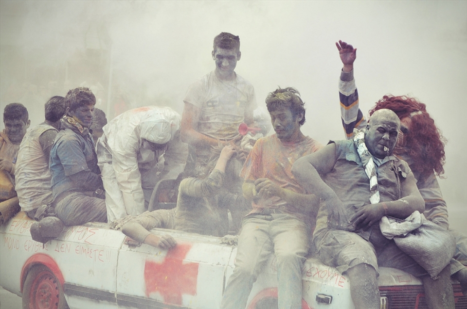 Coloring is added for effect while people paint their faces with charcoal