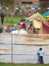 a boy is looking throught a hole to see the faire: by viajerastresletras, Views[250]