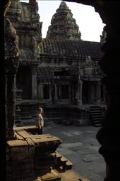 A man peacefully contemplates a temple at Angkor Wat  in Cambodia.: by viajerastresletras, Views[264]