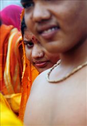A women peaks at the camera during the Ganesh Chaturthi festival in Mumbai, India.  This festival is held in honor of the Hinud God, Lord Ganesh, who has an elephant head. The festival is held for 11 days each year. : by victoriaphoto, Views[625]