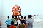 Men bring a statue of the Hinud god Ganesh into the water at Chowpatty beach, Mumbai. After bringing the statue of Lord Ganesh to the Ocean, they will then immerse the statue in water, drowning it, in tribute to the God.: by victoriaphoto, Views[1126]