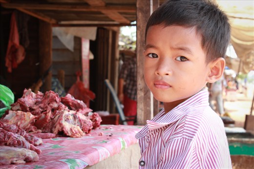 I would like to tell you a story of a place that left a strong impression on me. 

Upon entering the Somrong village at Shoutnikom district in Siem Reap in Cambodia there was a boy whose gaze is fascinating. He had certain, sincere and naive energy about him. His name is Leengphour and he penitently waits for his mother to finish her work so that they can join the rest of the village at the ceremony. His mother is a tailor but during the weekend she sells meat so that her youngest child can attend school. Leengphour father is an English teacher in Somrong High school. 