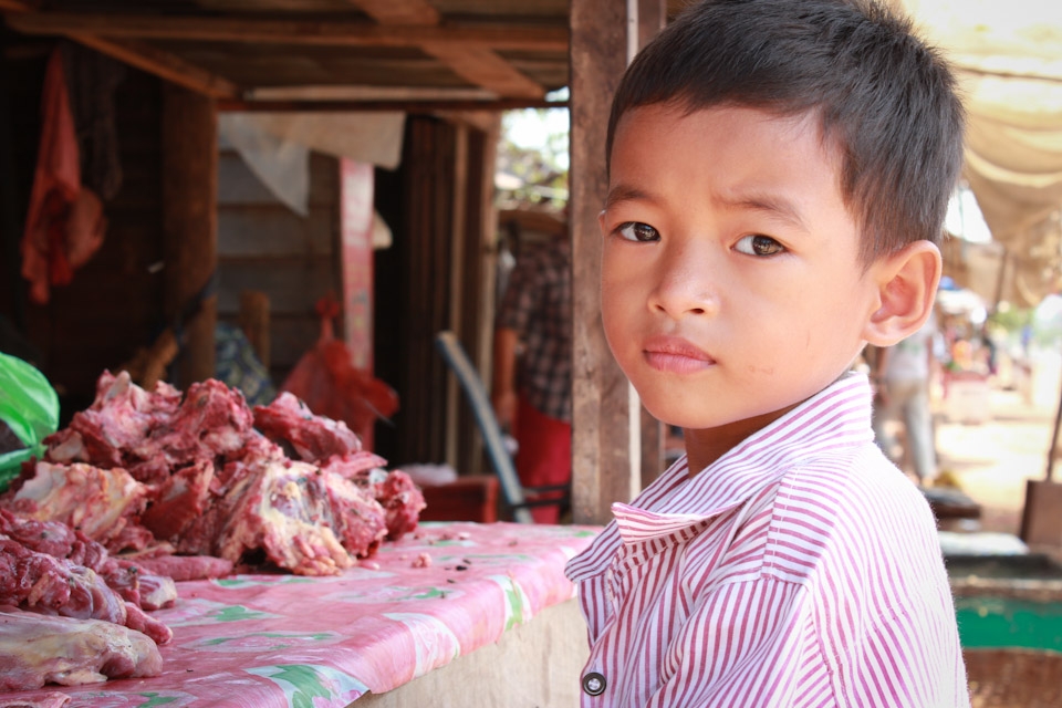 I would like to tell you a story of a place that left a strong impression on me. 

Upon entering the Somrong village at Shoutnikom district in Siem Reap in Cambodia there was a boy whose gaze is fascinating. He had certain, sincere and naive energy about him. His name is Leengphour and he penitently waits for his mother to finish her work so that they can join the rest of the village at the ceremony. His mother is a tailor but during the weekend she sells meat so that her youngest child can attend school. Leengphour father is an English teacher in Somrong High school. 