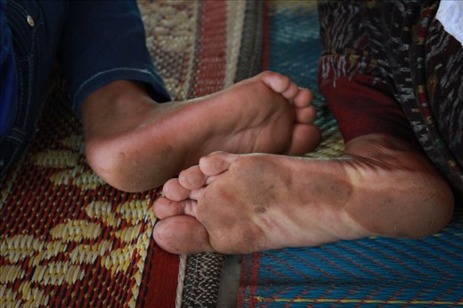 Mother and daughter hurried to the pagoda to prepare for the ceremony, while others are still working. Before entering the pagoda, they take of their shoes and even though that Sunday was really hot, they covered their knees.  