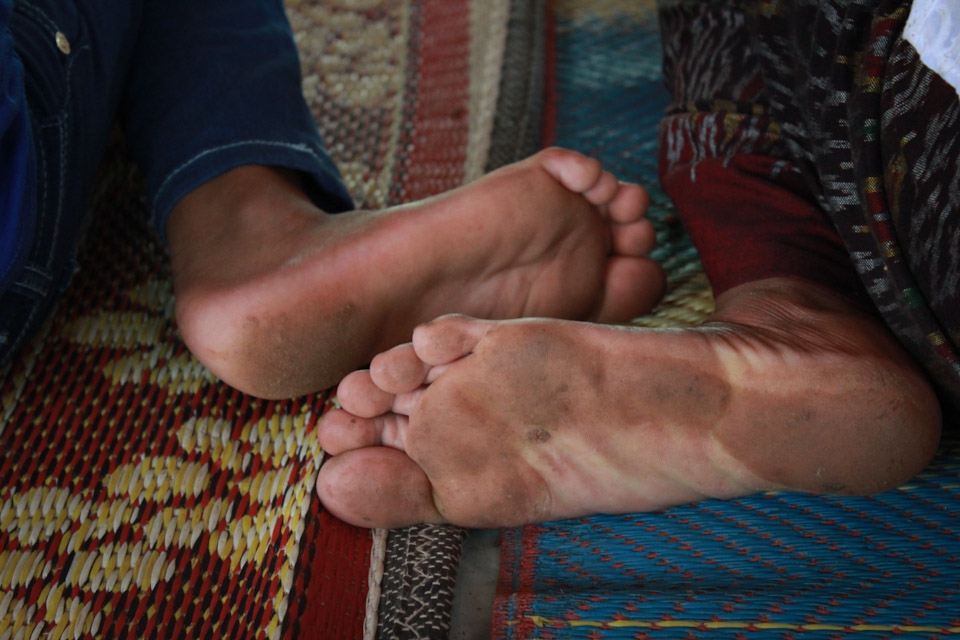 Mother and daughter hurried to the pagoda to prepare for the ceremony, while others are still working. Before entering the pagoda, they take of their shoes and even though that Sunday was really hot, they covered their knees.  