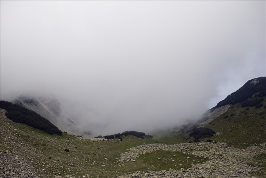 Route Sinanitsa, Pirin National Park, Bulgaria. 

At first sight this landscape as remote as it is , doesn't show any signs of human presence. However if you look closely you would be able to notice a sign which compared to the scale of the scenery has acquired an obscure depiction.
