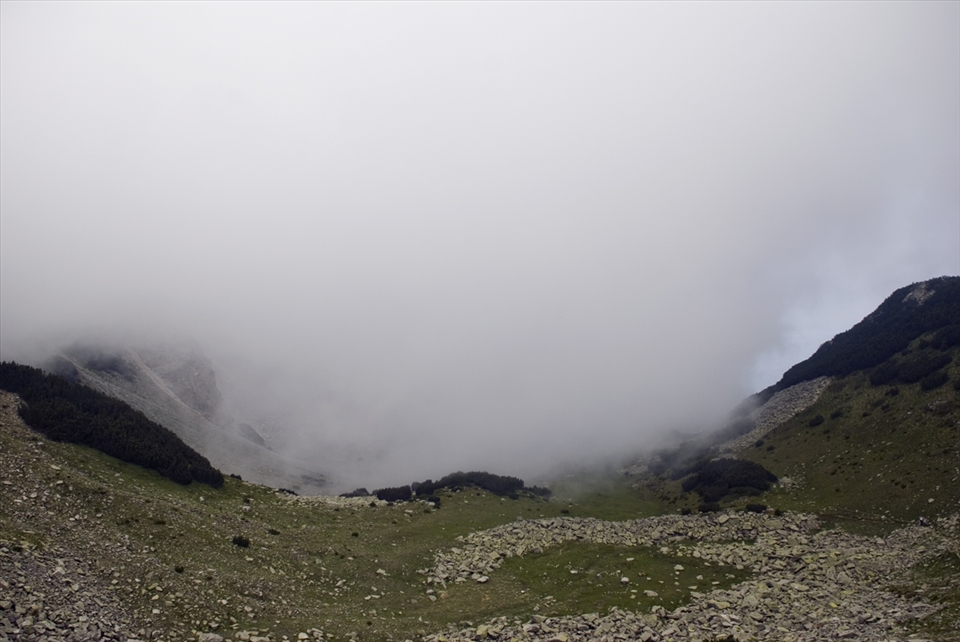 Route Sinanitsa, Pirin National Park, Bulgaria. 

At first sight this landscape as remote as it is , doesn't show any signs of human presence. However if you look closely you would be able to notice a sign which compared to the scale of the scenery has acquired an obscure depiction.