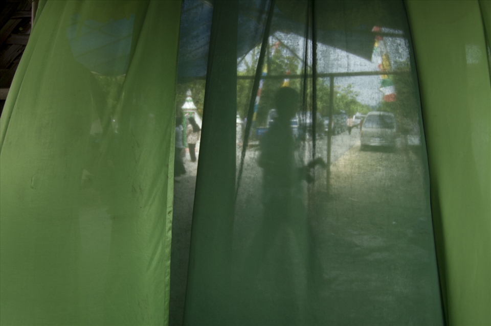 4. A silhouette of a wedding photographer, almost dissapearing behind the courtain. He is rushing out of the kitchen right to the scenery of the big event -the bride will soon be ready, everyone should take their places. Taken in Tawangsari, Jawa Tengah, Indonesia, january of 2012. Technical equipment: Nikon D50, lens AF-S DX NIKKOR ED 18-55mm 1:3.5-5.6G, auto exposure