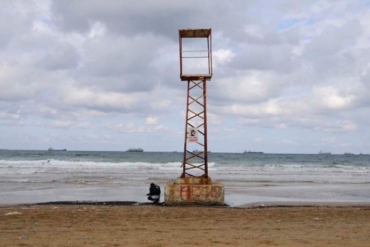In 2009 I was staying in Istanbul for the exchange program. My friend Mirva and me we decided one day to go to the beach by the Black sea. It was really strange to walk in the beach for 3-4 hours with no people at all just bumping into some signs of civilization. The weather was nice and light was soft. But the horizon was full of ships waiting in the line for something. Maybe they were waiting for a signal to enter the port. But the strict formation of them gave a feeling of something aggressive and unknown there.