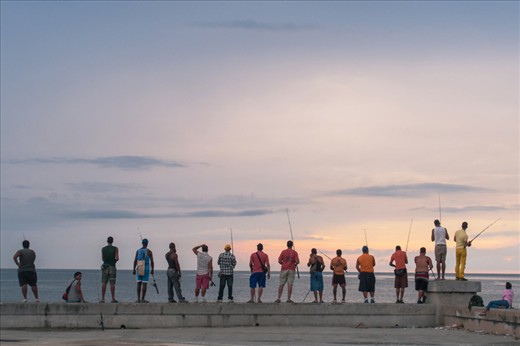 Cuban fishing at sunset on the Malecon in Havana, 