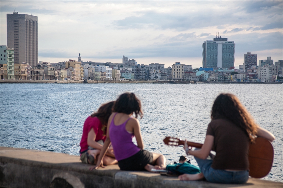 Teenage cubans playing music on the Malecon in Havana, Cuba