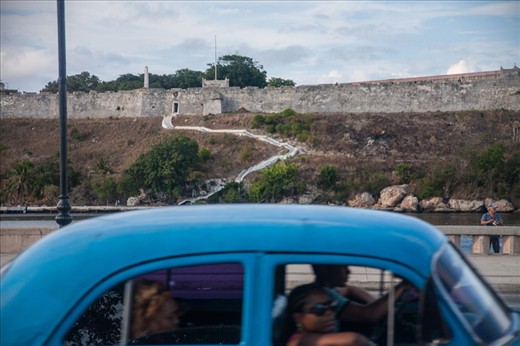 Cubans driving on the Malecon in Havana, Cuba
