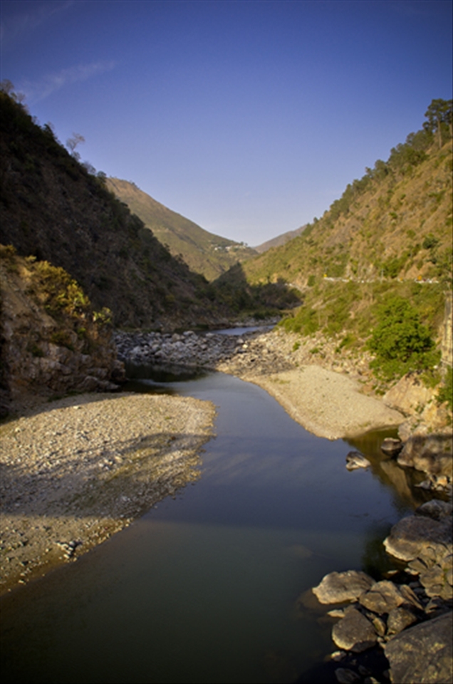 Sheer blue sky and river and green valley nothing else
