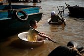Equipped with a a small cup and an oar, they go about the river asking for donations from the tourists.

Tonle Sap, Cambodia.: by vinhpham, Views[292]