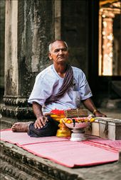 A Buddhist monk sits beside a plethora of handmade bracelets in return for a small donation to the temple.

Angkor Wat,  Cambodia.: by vinhpham, Views[443]