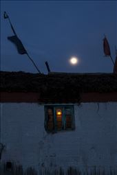 A traditional mud brick house, painted with a lime wash, prayer flags on roof: by vinnymo, Views[645]