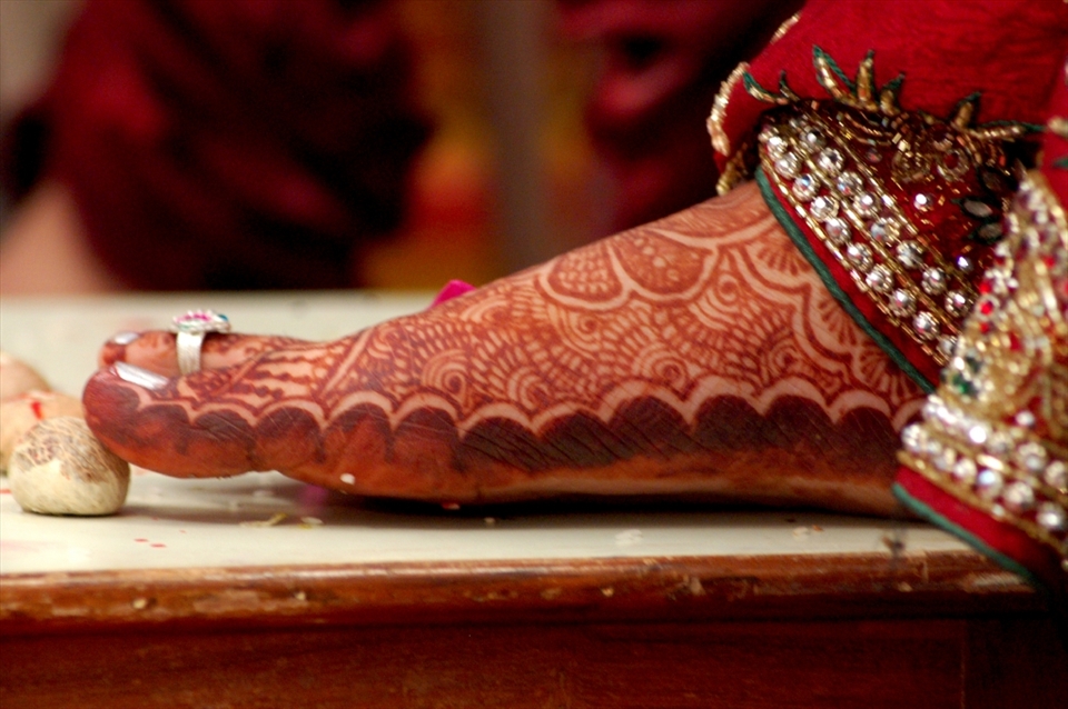 Indian weddings are known of its many rituals. They are not just a one day ceremony, pre-wedding ceremonies begin way before the wedding sometimes a week ago.
One of the most important pre wedding ceremonies is Mehendi (Heena) ceremony, this is the day when mehendi is applied on hands and feet of the bride and groom. It is like temporary tattoo. Beautiful designs are done on the hands and feet. Applying mehendi is very common in India during celebrations of festival and auspicious occasions. It is a common belief that the darker the color of mehendi on the hands, the more she is loved by her better half.
The signification of application of mehendi as a powerful herb is that it relaxes oneself from stress, anxiety, nervousness, which is very common during weddings.