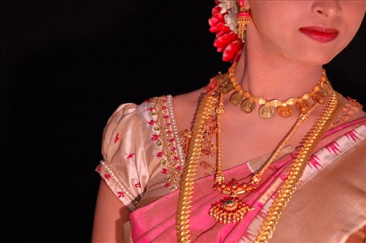 Gold ornaments play an important role in Hindu marriage- A wedding is incomplete without gifting of gold ornaments to each other. According to tradition gold ornaments can be worn only on the upper part of the body and silver ornaments are to be worn in the lower part(below navel).
Gold is the symbol of fire and it represents long life with great energy and strength. It is believed that the person who wears it is protected from the negative energies. As per the holy text gold destroys harmful germs in a person’s body and positive energy is absorbed in greater extent.
Most important is Mangalsutra- which is made of gold and with a combination of black beads.