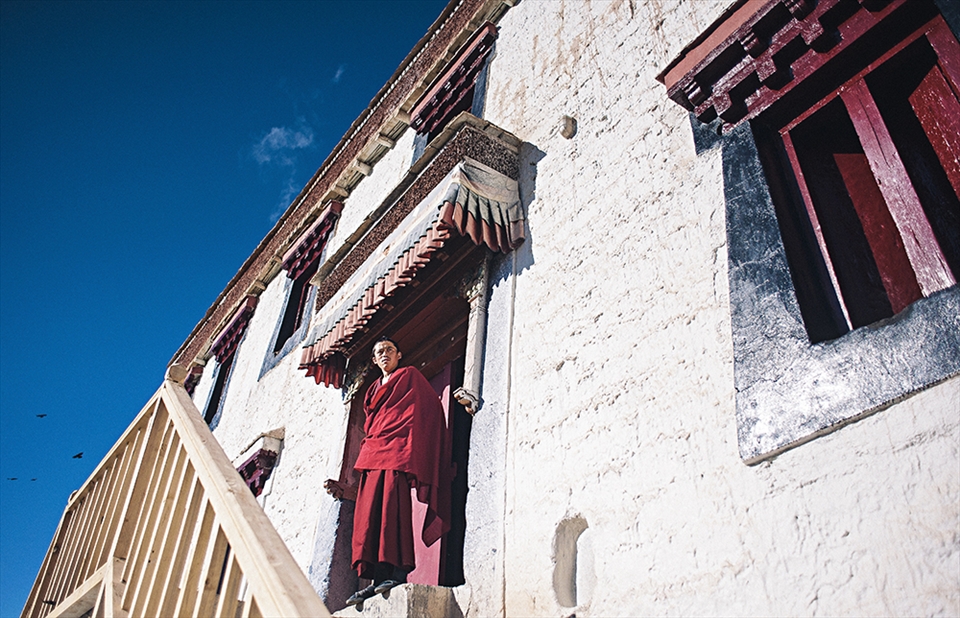 The morning sun is harsh. Nothing stops a monk from his contemplation of god.