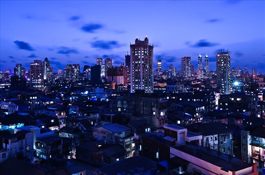People of Mumbai do not stop dreaming for a single second. There are hundreds of stories of men of good fortune growing from one of these small houses to the high-rises in the background.