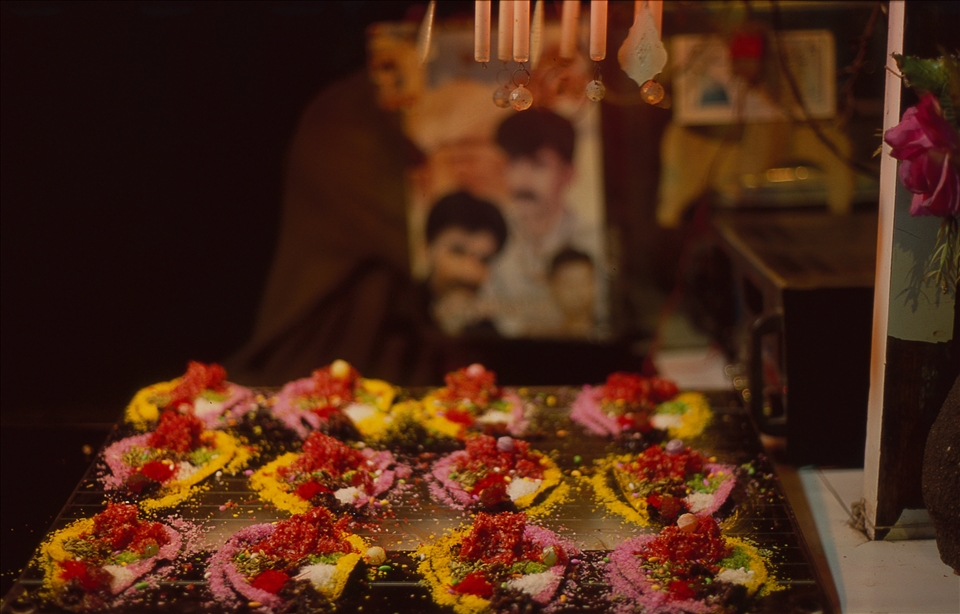 A paan stall. Paan chewing is quite popular to majority of men in Karachi. Paan is a bettel leaf wrap with areca nut, slaked lime paste, and other pastes and spices. Men spit red tinted paan juice all over the busy streets of city.