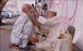 In Karachi the entrepreneur spirit is high. Whenever there is a demand for something, there is someone to do it. Some skills like this improvised barber shop are performed straight on the street.: by vlad, Views[598]