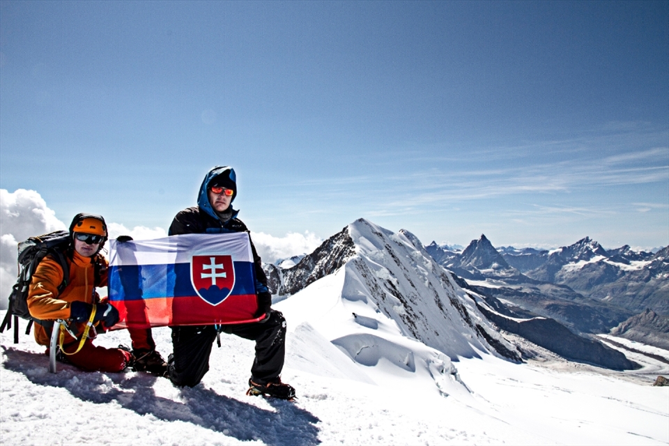 Finally reward! On the peak with national flag. You can see Matternhorn - Cervino in the back right side of the photo.