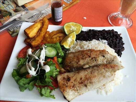 Typical Tico meal.  Beans and rice with fried plantain and some meat or fish.