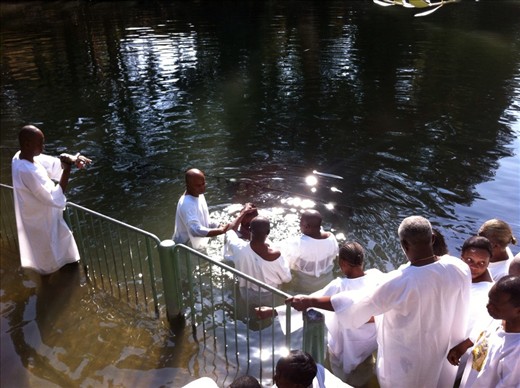 Watching people get baptized in the Jordan river, Israel