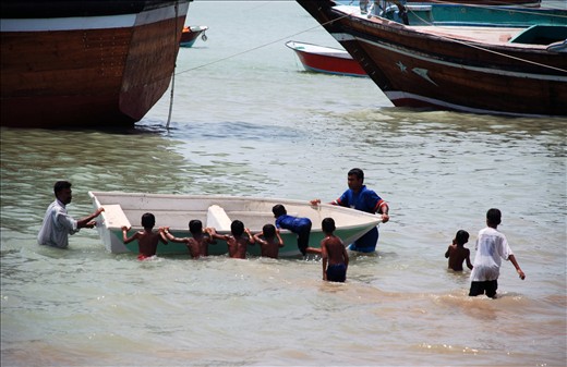 Happy children playing and swimming in the sea