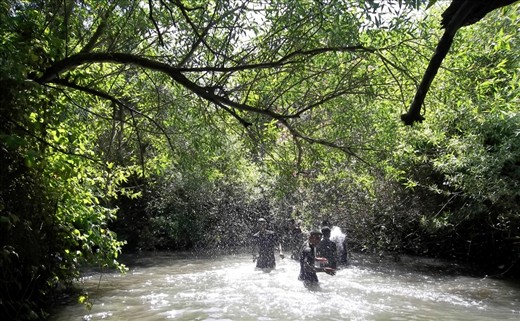 Splash Battle.
Youngsters having fun on a refreshing shady riverwalk on the Hermon Stream in Banias Natural Reserve. 
When the temperature is close to 40°C, even a small stream is a corner of paradise we must preserve, as water is the basic element of life and allows to regenerate energy from deep inside our soul.
