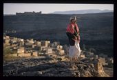 A Yemeni villager surveys his homeland, the ancient fortress above that once protected the valley and his village below, glowing in the last beams of the sun to penetrate the narrow gorge.Within a few years his long-time president will be ousted and US drone strikes will threaten this tranquil landscape.: by wbloomhuff, Views[744]
