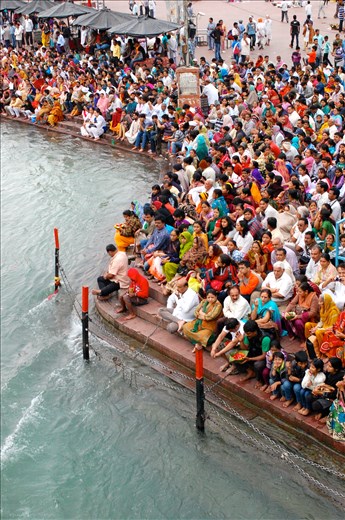 Thousands of worshippers pack onto the banks of the Ganges River for Aarti.