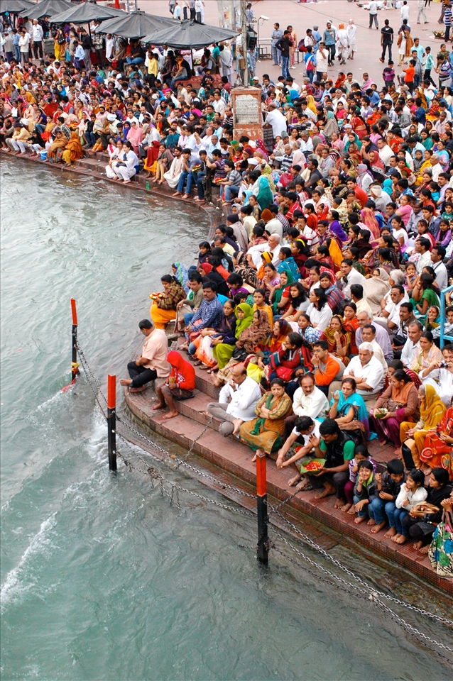 Thousands of worshippers pack onto the banks of the Ganges River for Aarti.